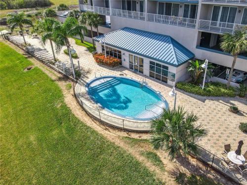 an overhead view of a swimming pool in front of a house at Sunshine Oasis - Orlando Lakefront Luxury in Orlando