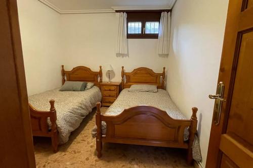 En eller flere senge i et værelse på Casa Rural Santo Domingo