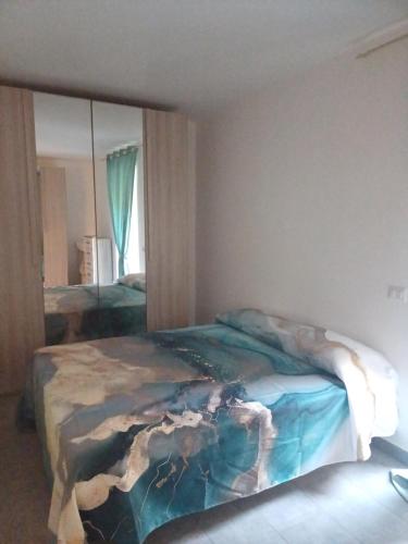 a bedroom with a bed and a large mirror at Casa Vacanze Aversa centro 2 in Aversa