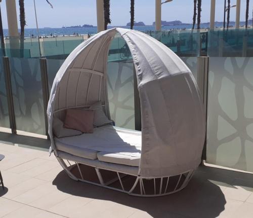 A bed or beds in a room at Luxury Beach Front Apartment with Pool