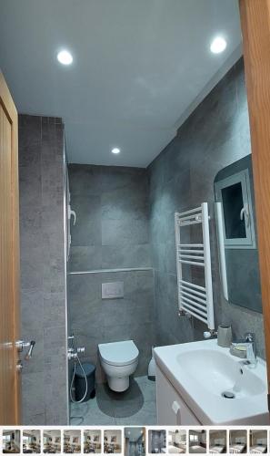 a bathroom with a toilet and a sink at Nouvel Horizon in Nabeul