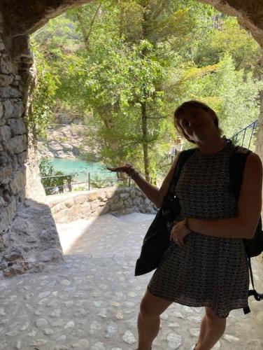a woman in a dress standing in a tunnel at Chambre campagnarde in Roquestéron