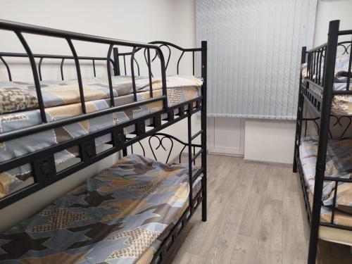 a group of bunk beds in a room at Aydeniz hostel in Chişinău