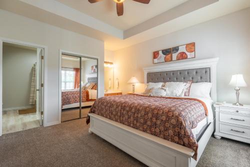 a bedroom with a bed and a mirror at Golf View - Elevator Accessible - Center Of Branson - FREE TICKETS INCLUDED - RL8-11A in Branson