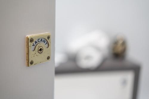 a close up of a light switch on a door at Bankton Rooms & Lodges in Livingston