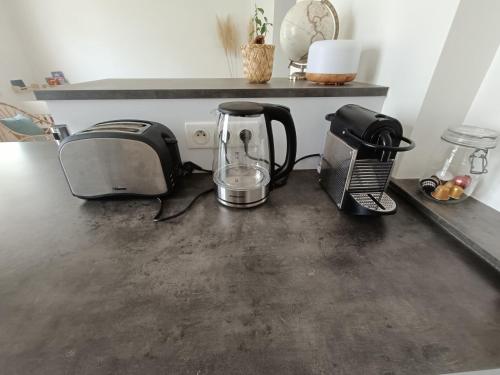 a kitchen counter with a coffee maker and a toaster at T3 centre-ville avec parking in Tours