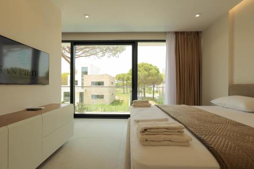 Postel nebo postele na pokoji v ubytování SanPietro Vacation Rentals