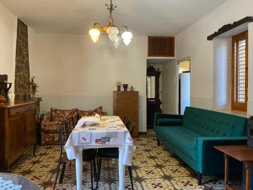 a living room with a couch and a table at La Casita Peñablanca in Eslida