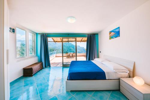 Ένα ή περισσότερα κρεβάτια σε δωμάτιο στο Eden view Ravello houses