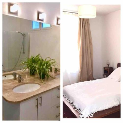 une salle de bain avec un lavabo et un miroir dans l'établissement Charmant Appt 2/4 pers Quartier Père Lachaise, à Paris