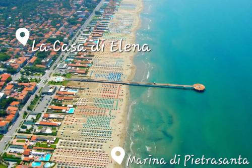 an aerial view of a beach with a pier at La casa di Elena Versilia - Two Apartments in Marina di Pietrasanta