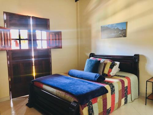 Ein Bett oder Betten in einem Zimmer der Unterkunft Hotel Plenitud Jardín