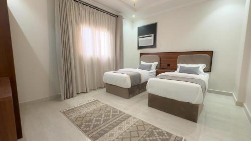 Katil atau katil-katil dalam bilik di Vatoran Apartments Khalidiyah