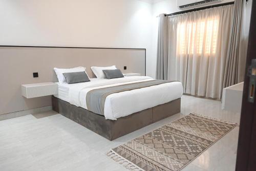 Katil atau katil-katil dalam bilik di Vatoran Apartments Khalidiyah