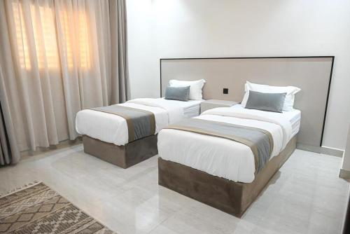 Katil atau katil-katil dalam bilik di Vatoran Apartments Khalidiyah