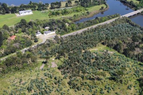 an aerial view of a river and a bridge at Cabana de pesca e lazer Represa Usina Mafra sc in Mafra