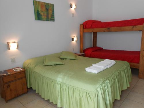 Ένα ή περισσότερα κρεβάτια σε δωμάτιο στο Alta Gracia Hostel