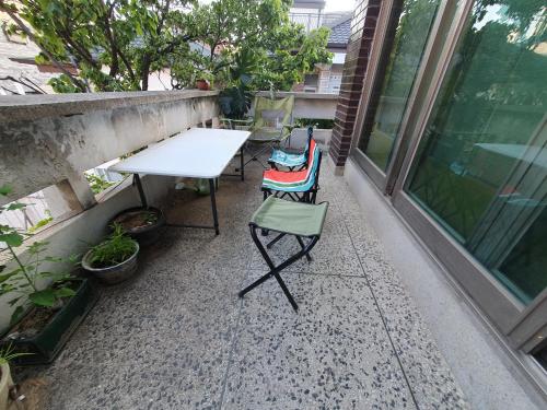 a table and two chairs on a patio at Seoul Papa Guesthouse 외국인전용 in Seoul