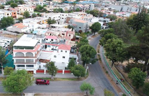 an aerial view of a city with buildings and a street at Suite Picchu Picchu in Arequipa