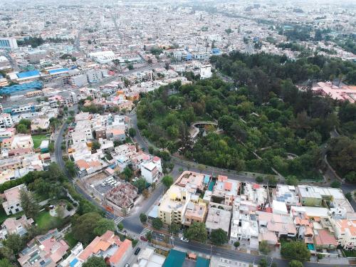 an aerial view of a city with buildings at Suite Picchu Picchu in Arequipa
