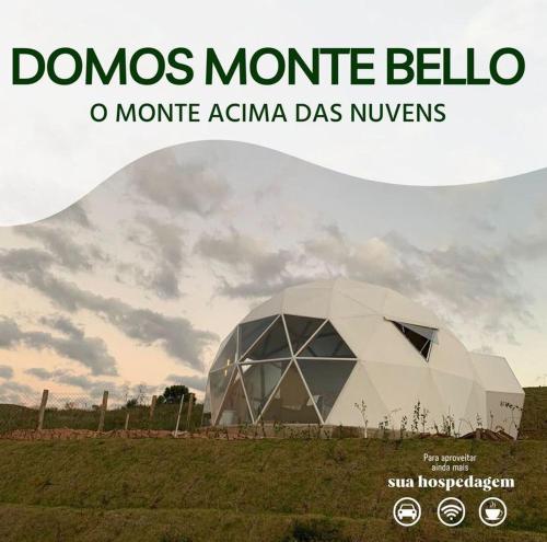 a dome in a field with the words domes nominia bello at Domo montebelo Campos do Jordão in Campos do Jordão