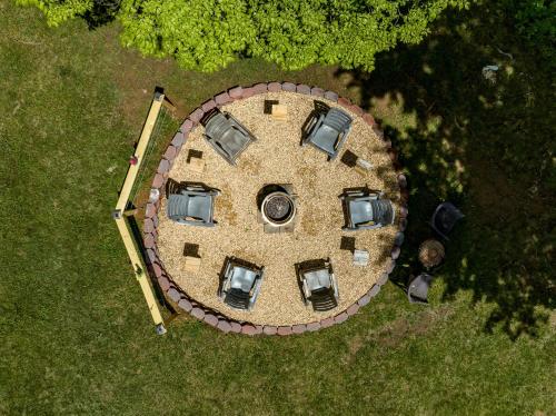 an overhead view of a circular house with parked cars at Waterfront Cabin 20 Mins to National Park & Massanutten! in Stanardsville