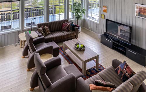a living room with couches and a flat screen tv at Amazing Home In Stranda With Jacuzzi in Stranda