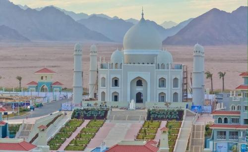 a rendering of a mosque with mountains in the background at Porto Sharm elsheikh-Aqua park view in Sharm El Sheikh