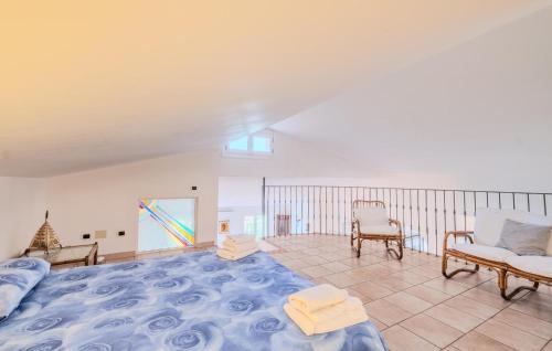 a living room with a large bed and a couch at Nice Home In Imperia With Wifi in Imperia