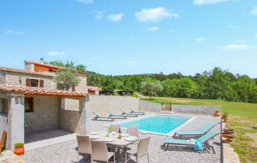an external view of a villa with a swimming pool at Cozy Home In Condillac in Condillac