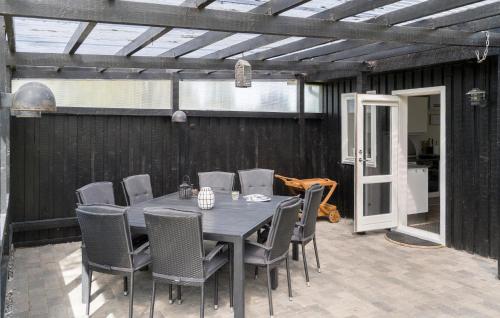 a table and chairs sitting on a patio at Pet Friendly Home In Odder With Wifi in Odder