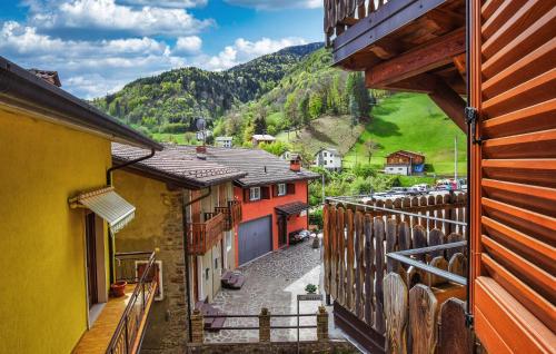 a view from a balcony of a town with buildings at Awesome Apartment In Pezzoro in Lavone