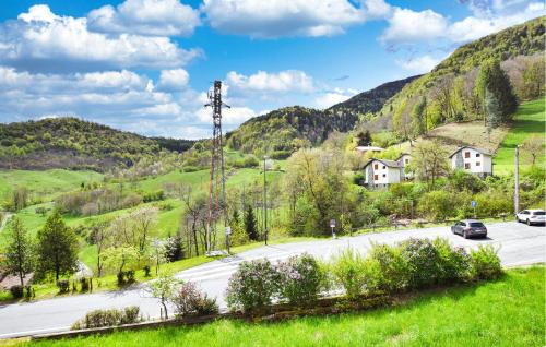 a road in the mountains with cars on it at Awesome Apartment In Pezzoro in Lavone