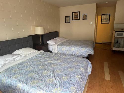 Postel nebo postele na pokoji v ubytování City Centre Motel II