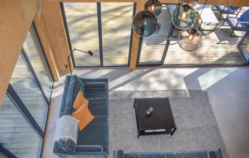 an overhead view of a living room with a couch and a table at Amazing Home In Arkelstorp With Sauna in Arkelstorp