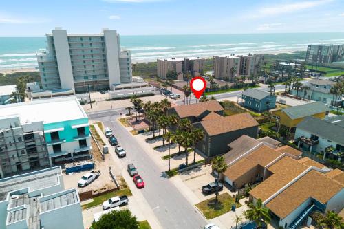 an aerial view of a city with a red sign at Beautiful 2 Bed 2 bath 1st Floor condo by beach with Pool in South Padre Island