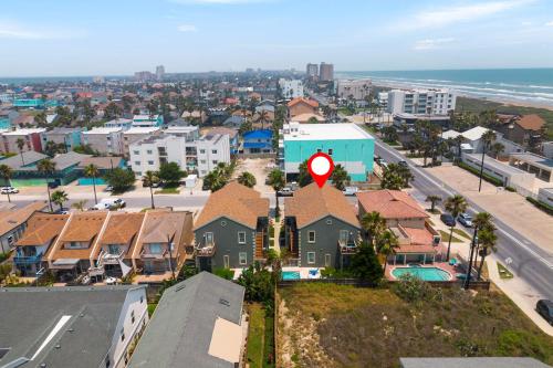 an aerial view of a city with a red sign at Beautiful 2 Bed 2 bath 1st Floor condo by beach with Pool in South Padre Island