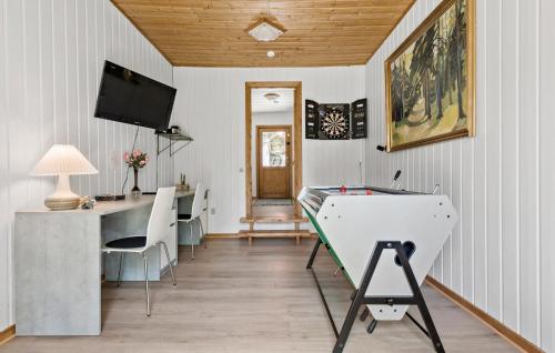 a room with a desk and a ping pong table at Amazing Home In Farsø With Wifi in Farsø