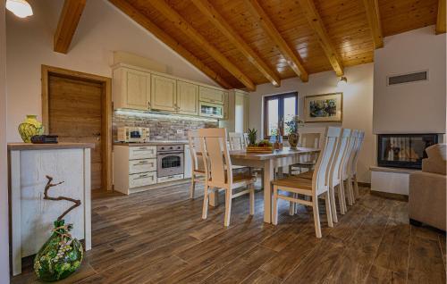 a kitchen and dining room with a table and chairs at Villa Dajana in Potpićan