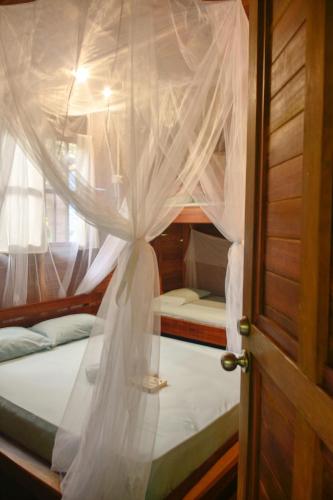 Postel nebo postele na pokoji v ubytování La tarima del colibri Ecolodge
