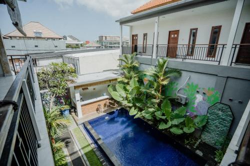 an overhead view of a house with a swimming pool at Kayuma House Canggu in Canggu