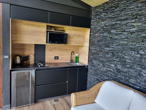 a kitchen with a sink and a counter top at Maranatha. Grotto & Boutique+Hydrotherapy in Pereira