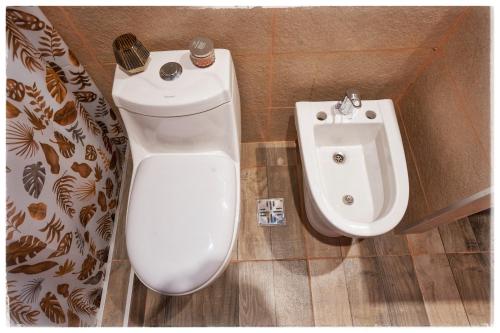 a bathroom with a toilet and a bidet at Ocho Cabañas in San Carlos de Bariloche