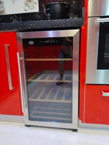 a oven with its door open in a kitchen at Luxurious Penthouse La Grande Résidence with Home Theater & Netflix in Angeles