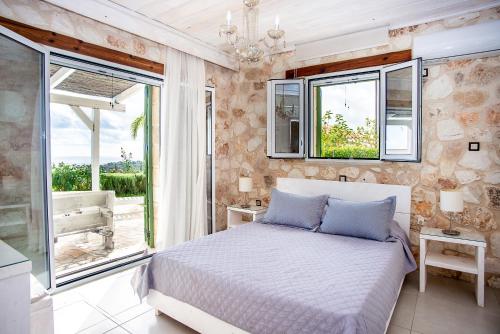 Ένα ή περισσότερα κρεβάτια σε δωμάτιο στο Trapezaki Garden Villas