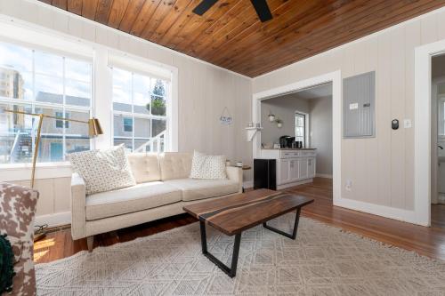 a living room with a couch and a coffee table at Be A Nomad - Beach Bliss - Close to beach in Jacksonville Beach