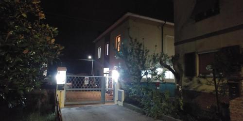 a house with a gate at night at B&B Itala in Recanati