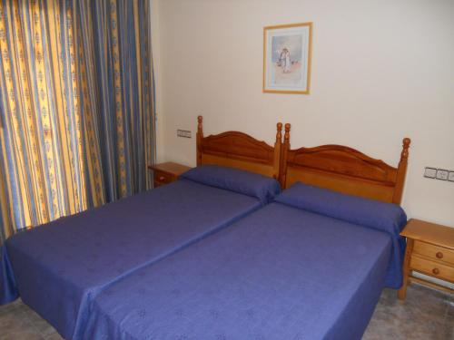 Posteľ alebo postele v izbe v ubytovaní Apartamentos Palas Salou