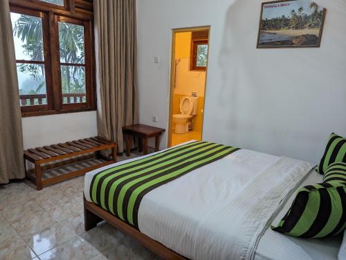 Postel nebo postele na pokoji v ubytování Brilliant View Home Stay
