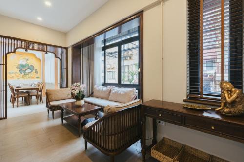 a living room with a couch and a table at Lily Hidden Homestay in Hanoi